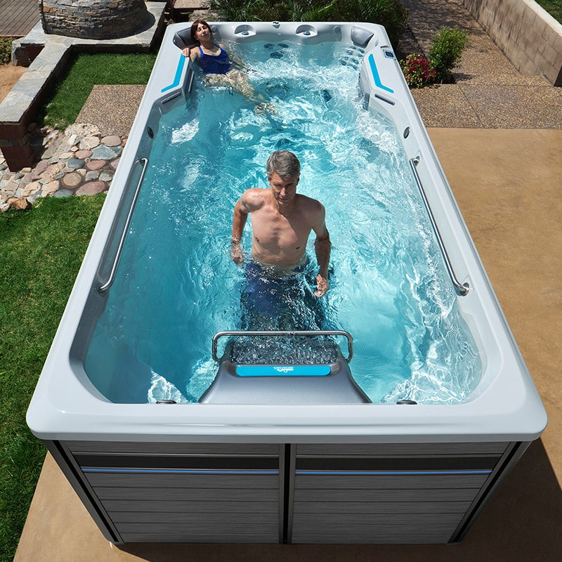 man and woman enjoying endless pool for fitness