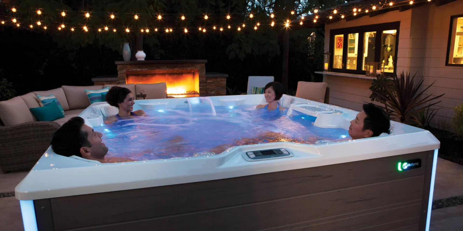 four people enjoying a hot spring spa from lifestyle outdoor.