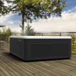 sleek hot tub on a wooden deck with a scenic outdoor view.