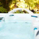 outdoor hot tub in los angeles with bubbling water and an elegant water feature.