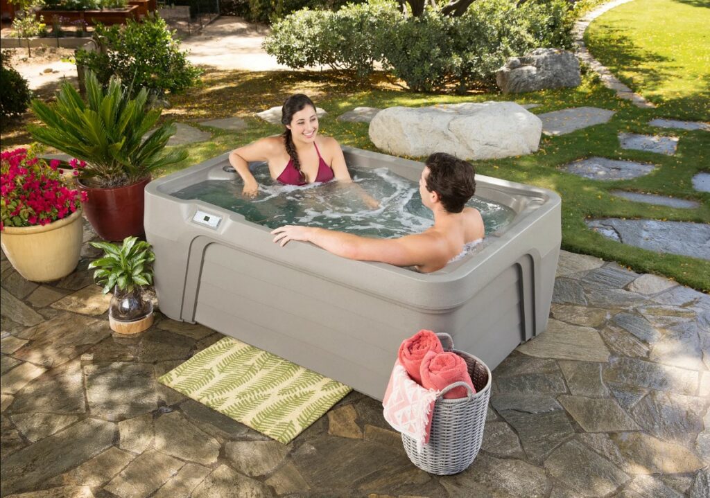 couple enjoying their fantasy spa outdoor hot tub