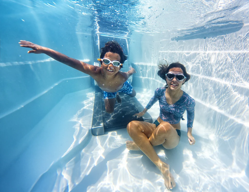 best swim spas at lifestyle outdoor - kids playing in an endless pools swim spa